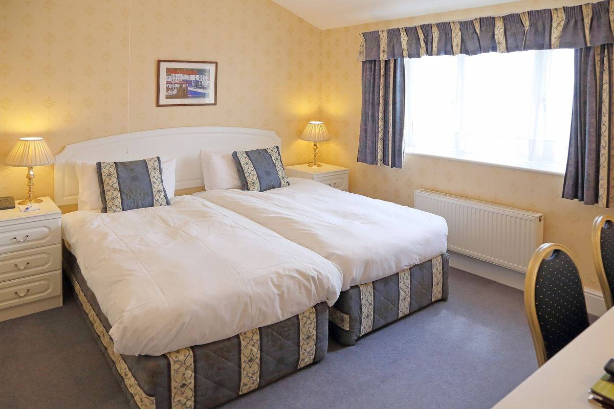 A twin room at the Saxonville Hotel